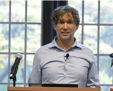 man in front of windows. 