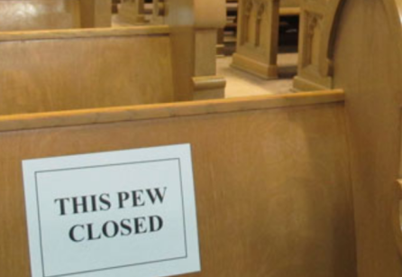 empty church with "this pew closed" sign 
