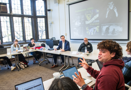 Students in a classroom with tall windows