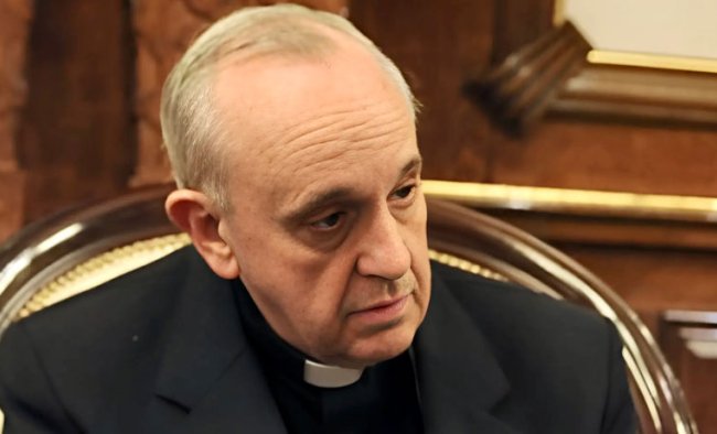 Image of Pop Francis wearing clerical garments looking to the right. 